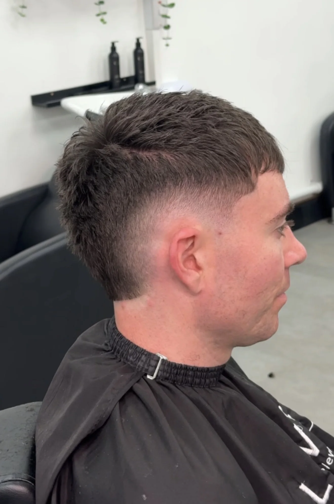 Studio Eleven barbershop haircut — modern mullet fade