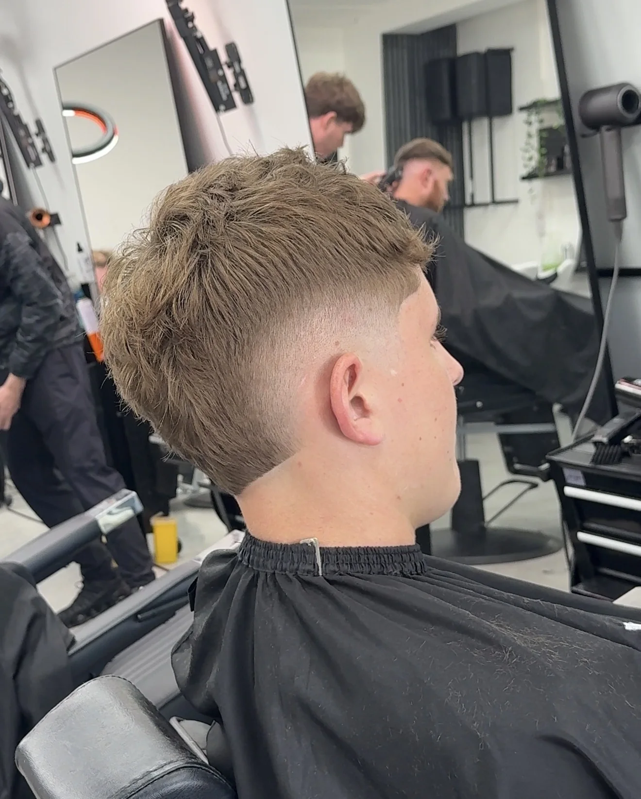 Studio Eleven barbershop haircut — wavy textured cut